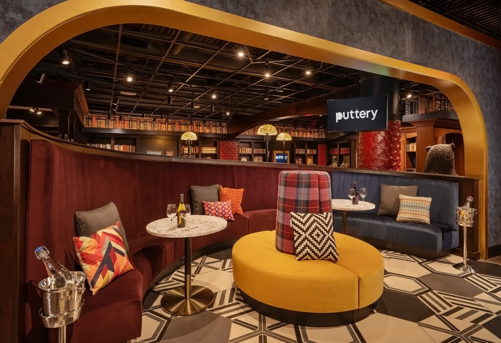 Puttery Charlotte indoor mini golf lounge with cozy seating, bold decor, craft cocktails, and immersive course design.