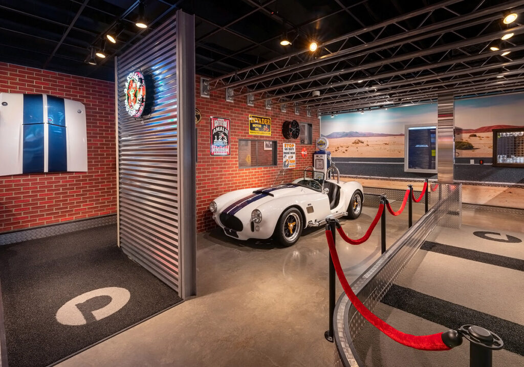 Puttery Pittsburgh indoor mini golf course with sleek car-themed decor, lounge seating, and immersive design.