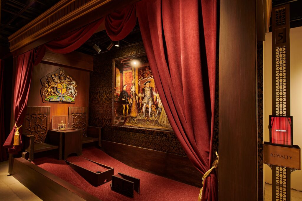 Puttery New York City indoor mini golf course with dramatic lighting, rich textures, and immersive lounge design.