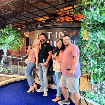 two couples posing on rooftop course