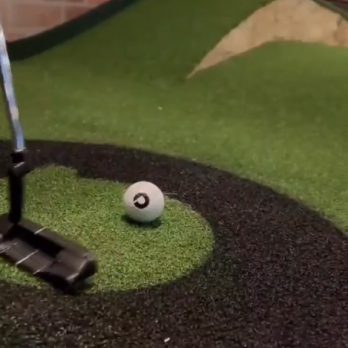 player putting on mini golf course