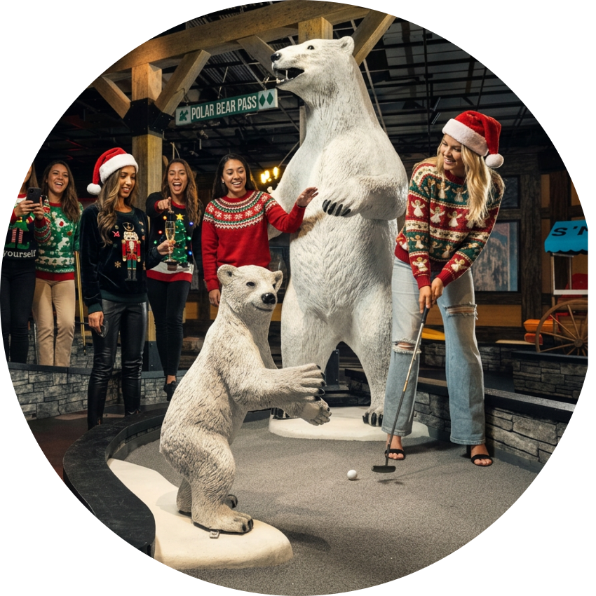 Friends in holiday sweaters play indoor mini golf on Puttery’s lodge-themed course with polar bear statues