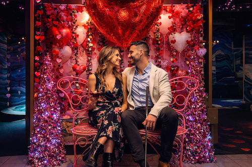 Couple on the butterfly bench of the Puttery Talk Birdie to Me course