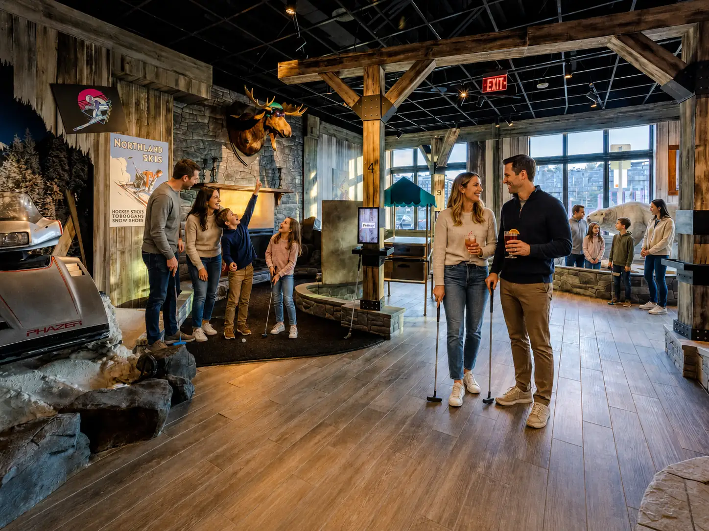 Families and a couple play indoor mini golf on the Lodge Course at Puttery Miami during the day.